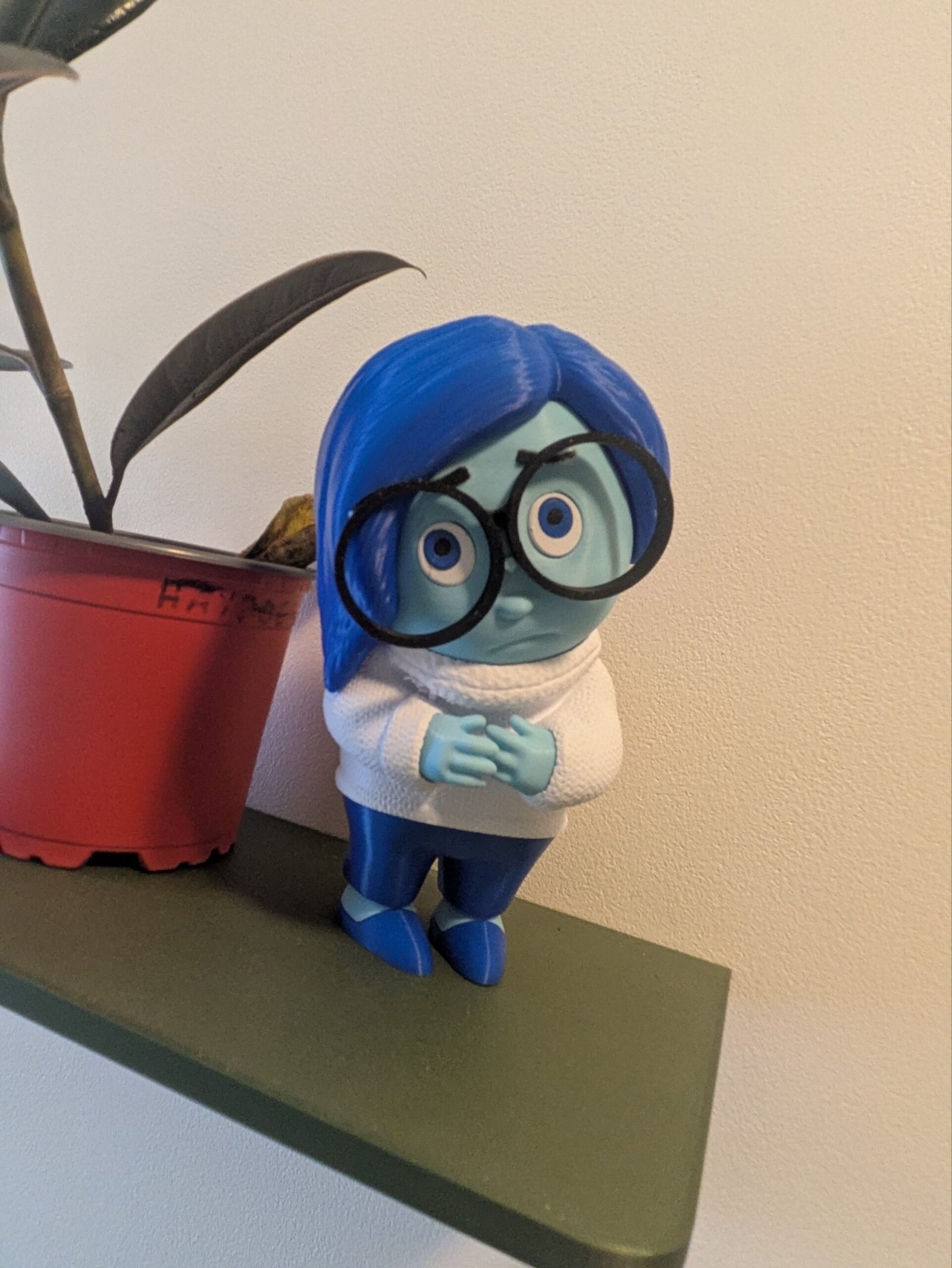 Figurine Décorative Émotion – Personnage Bleu à Lunettes